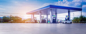 Retail gas fuel station with clouds and blue sky