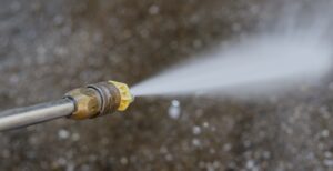 Outdoor floor cleaning with high pressure water jet