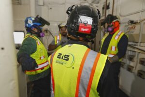 EIS crew members have safety meeting on demolition project site